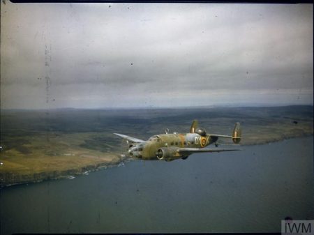 Lockheed Hudson Mark V, AM853 'OY-K', of No 48 Squadron RAF based at Wick, Caithness, Scotland, in flight along the coast, early 1942. Courtesey Imperial War Museum.